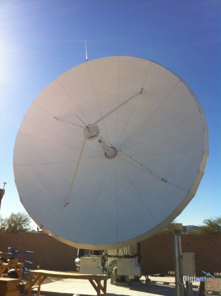 Earth station antenna reflector against a blue sky