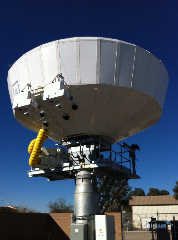 Earth terminal antenna on a pedestal under a deep blue sky