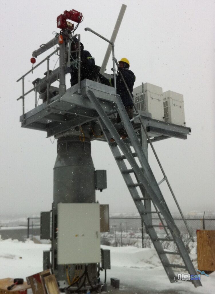 Field service technicians working on an antenna platform tower