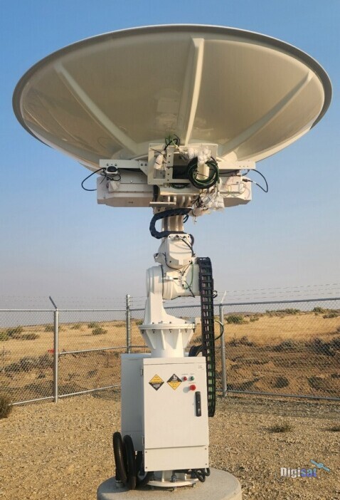 VSAT antenna on a pedestal at a fenced secure site