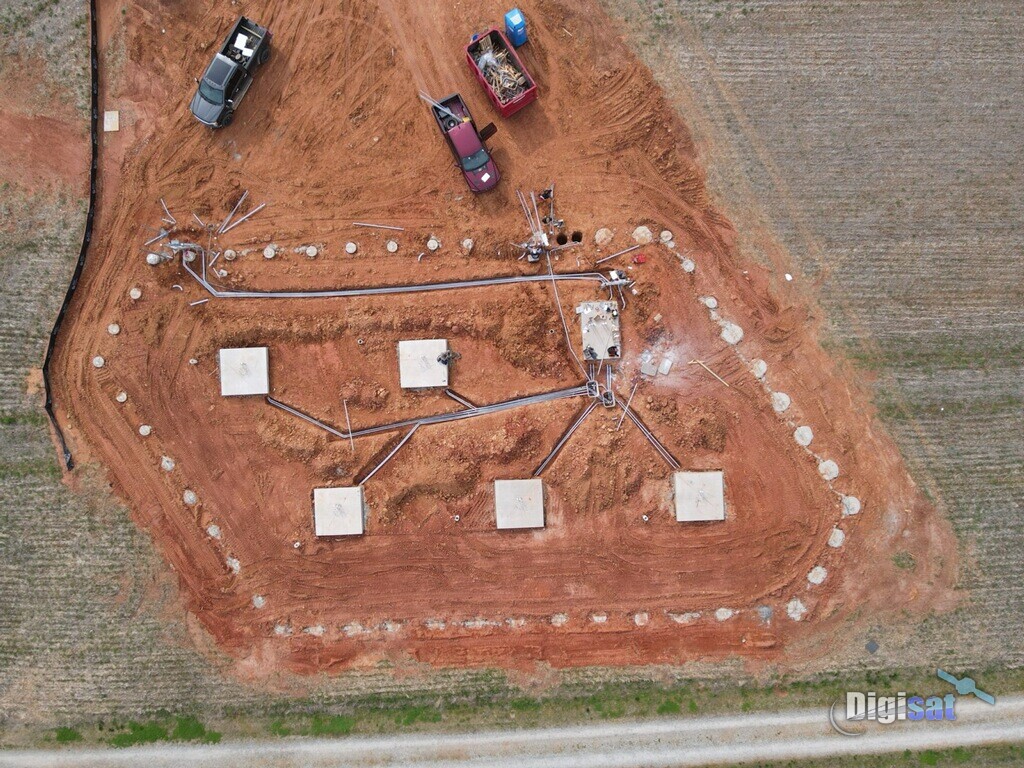 Aerial view of antenna pads and conduit runs during construction