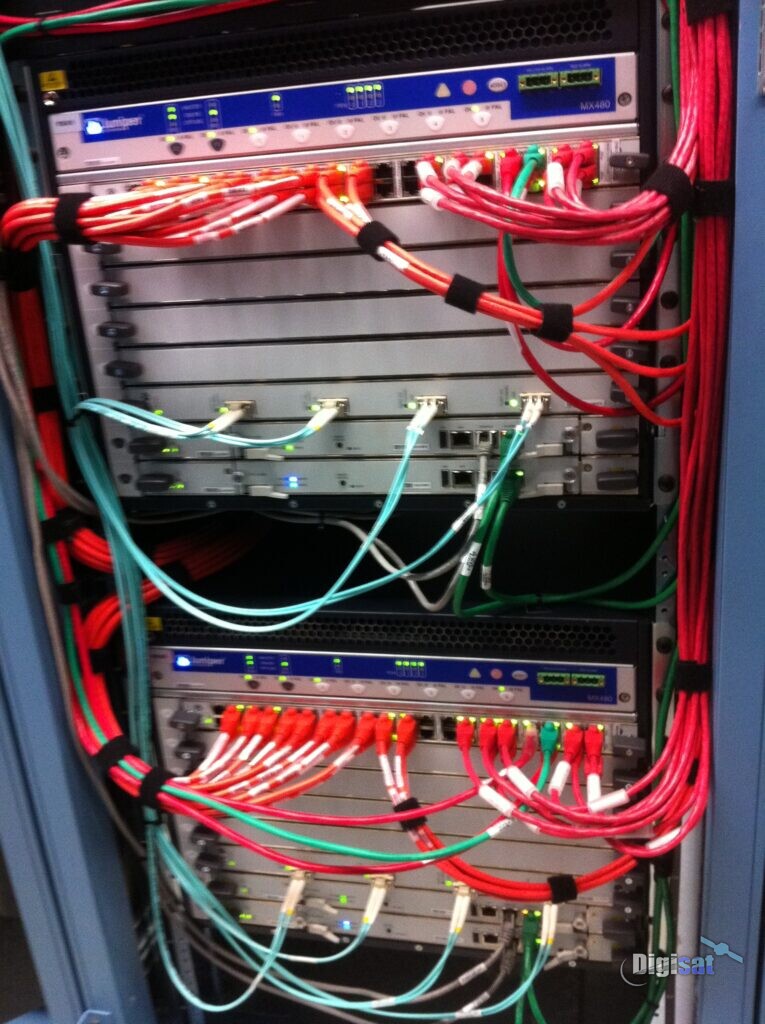 Network equipment rack with integrated fiber and copper cabling