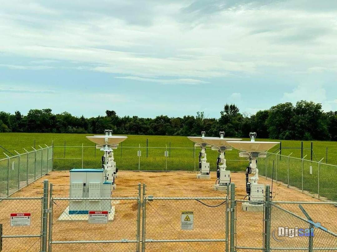 LEO gateway site with four tracking antennas inside a fenced compound